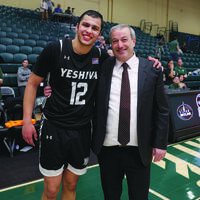 Zevi Samet, who was named Skyline Conference Player of the Year, celebrates with Rabbi Dr. Ari Berman, President of Yeshiva University.